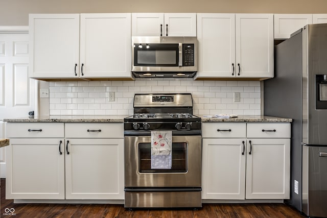 kitchen featuring white cabinetry and appliances with stainless steel finishes