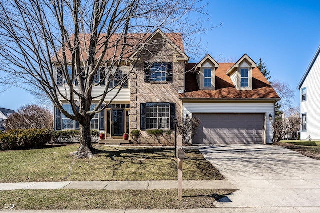 view of front of home featuring brick siding, an attached garage, concrete driveway, and a front lawn