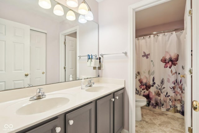 full bath with a shower with shower curtain, double vanity, toilet, and a sink