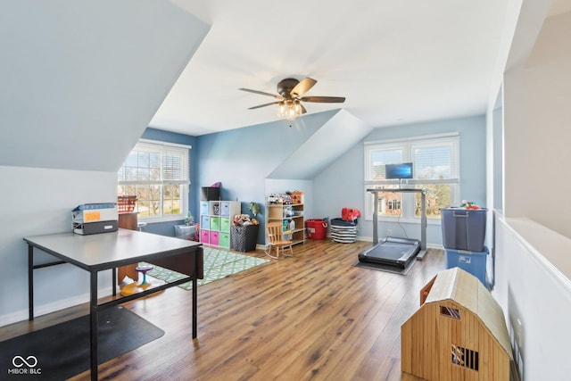 playroom featuring vaulted ceiling, baseboards, a ceiling fan, and wood finished floors