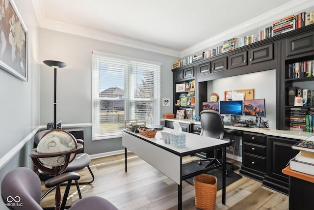 home office featuring light wood-style floors and crown molding