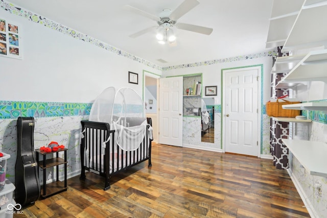 bedroom with a ceiling fan and wood finished floors