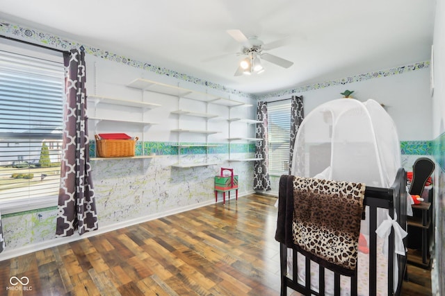 interior space featuring baseboards and wood finished floors