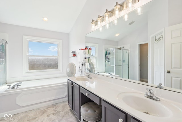 full bath featuring a bath, a shower stall, lofted ceiling, and a sink