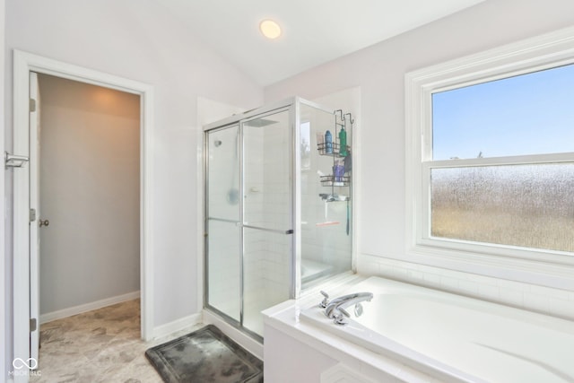 full bathroom featuring baseboards, a bath, a stall shower, and vaulted ceiling