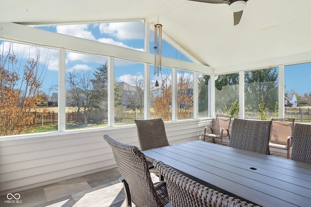 sunroom / solarium with lofted ceiling and ceiling fan