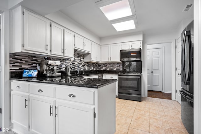 kitchen featuring visible vents, a peninsula, decorative backsplash, black appliances, and white cabinetry