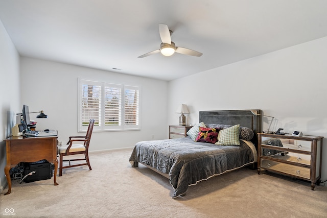 bedroom featuring light colored carpet and ceiling fan