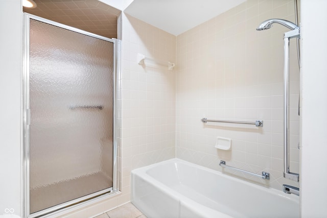 full bath with a shower with door, tile patterned flooring, and a bathtub