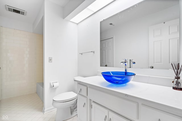 bathroom with visible vents, vanity, toilet, and a shower