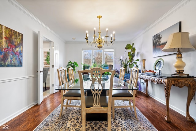 dining room featuring a chandelier, wood finished floors, baseboards, and ornamental molding