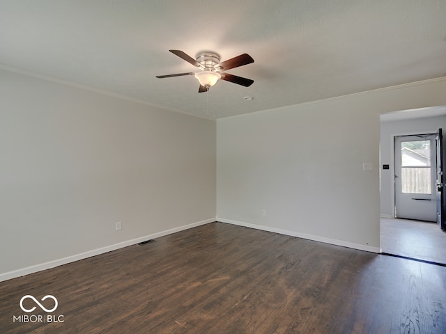 2955 Mars Hill St, Indianapolis, IN 46241 - empty room featuring a ceiling fan, crown molding, baseboards, and dark wood-type flooring