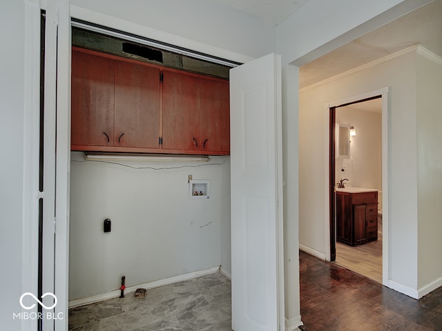 2955 Mars Hill St, Indianapolis, IN 46241 - laundry room featuring cabinet space, hookup for a washing machine, crown molding, wood finished floors, and baseboards