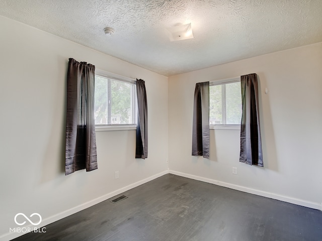 2955 Mars Hill St, Indianapolis, IN 46241 - empty room with dark wood-style floors, baseboards, and a textured ceiling