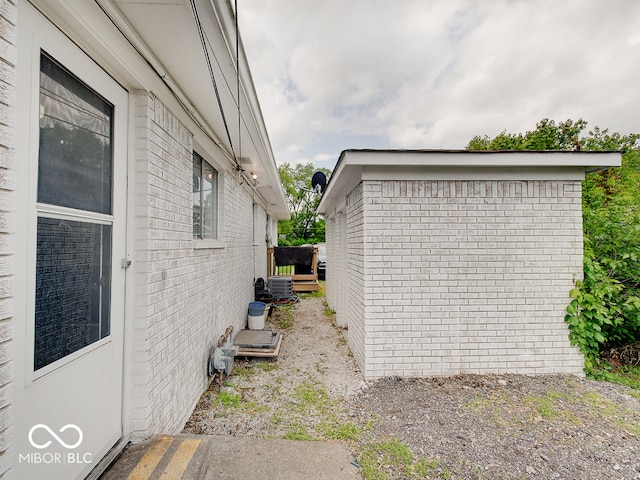 2955 Mars Hill St, Indianapolis, IN 46241 - view of property exterior featuring brick siding and central AC unit
