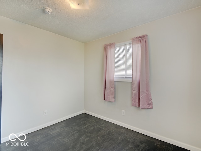 2955 Mars Hill St, Indianapolis, IN 46241 - spare room featuring dark wood-style floors, baseboards, a smoke detector, and a textured ceiling