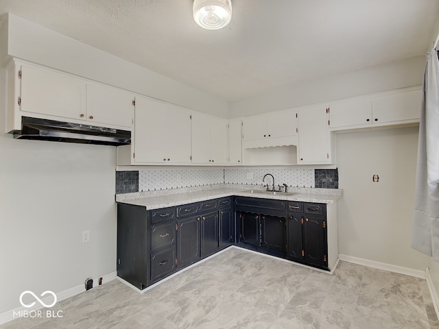 2955 Mars Hill St, Indianapolis, IN 46241 - kitchen with a sink, white cabinetry, backsplash, and dark cabinets