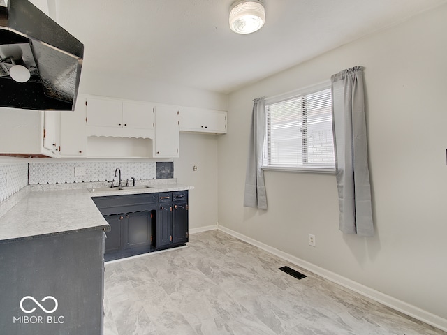2955 Mars Hill St, Indianapolis, IN 46241 - kitchen featuring a sink, white cabinets, backsplash, open shelves, and light countertops