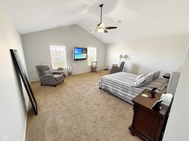 bedroom with a ceiling fan, carpet, baseboards, vaulted ceiling, and a textured ceiling