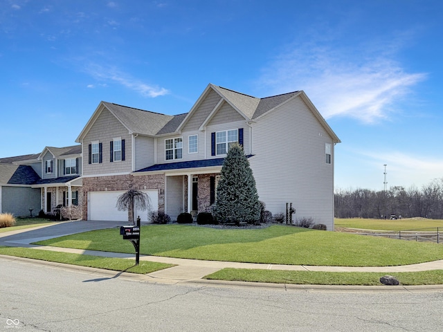 view of front of home featuring driveway, an attached garage, and a front lawn