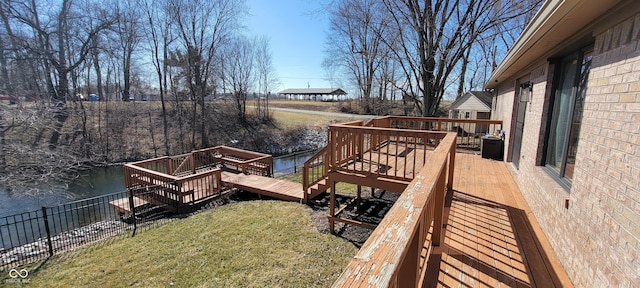 dock area with a wooden deck and a yard