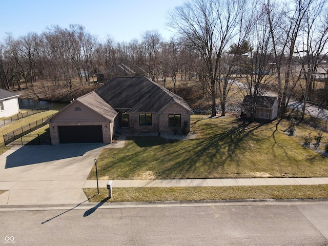 view of front of house featuring fence, concrete driveway, a front yard, a garage, and brick siding