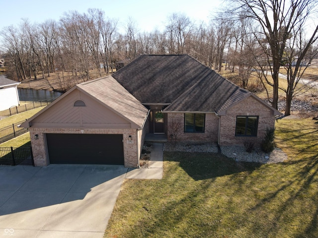 single story home with fence, concrete driveway, a front yard, a garage, and brick siding