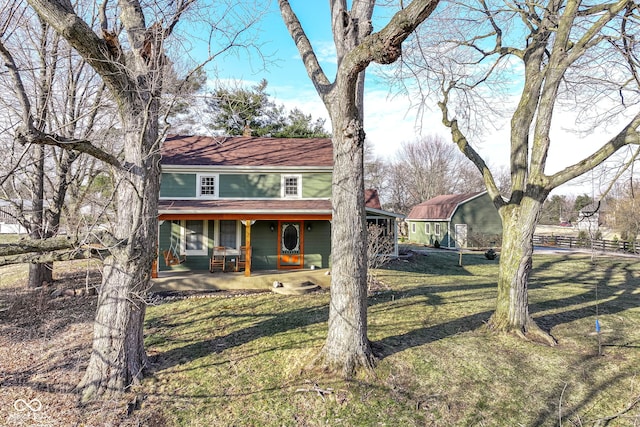 view of front of property with a porch and a front yard