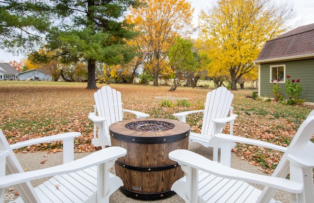 exterior space featuring an outdoor fire pit