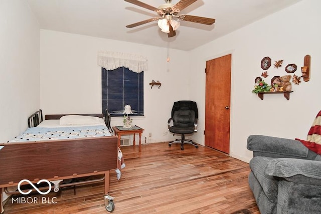 bedroom featuring ceiling fan and wood finished floors