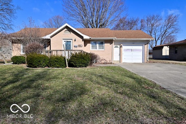 ranch-style home with driveway, an attached garage, a shingled roof, a front lawn, and brick siding