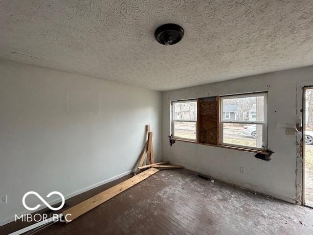 empty room with a textured ceiling