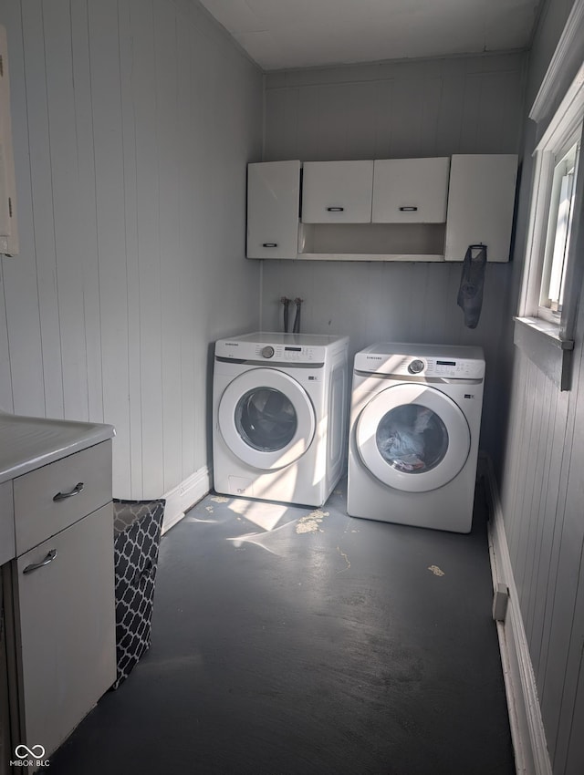 laundry area with cabinet space and washer and clothes dryer