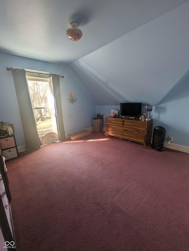 additional living space featuring baseboards, carpet, and lofted ceiling