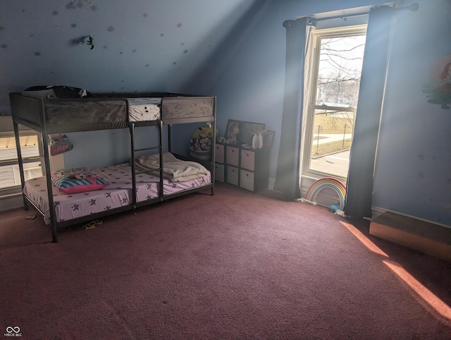 carpeted bedroom featuring lofted ceiling