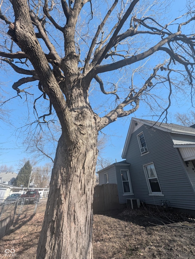 view of side of property featuring fence