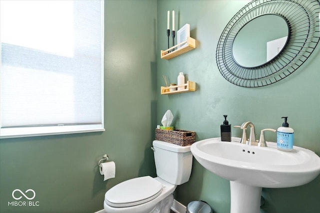 bathroom with toilet and a sink