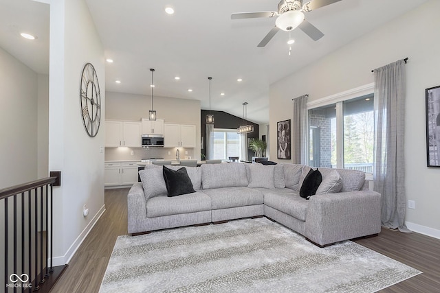 living room featuring dark wood finished floors, recessed lighting, and ceiling fan