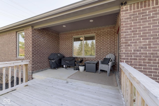 wooden terrace featuring grilling area