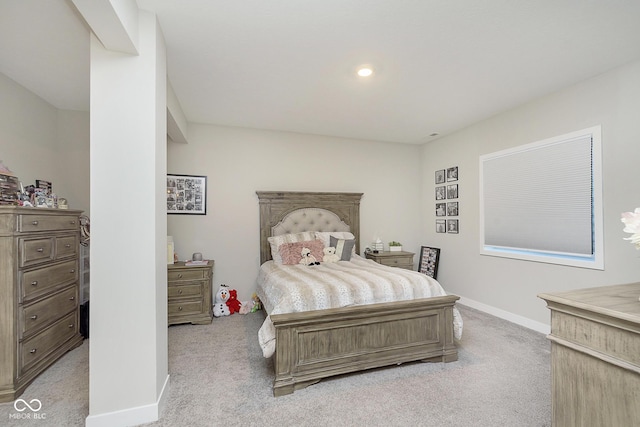 bedroom featuring recessed lighting, light colored carpet, and baseboards