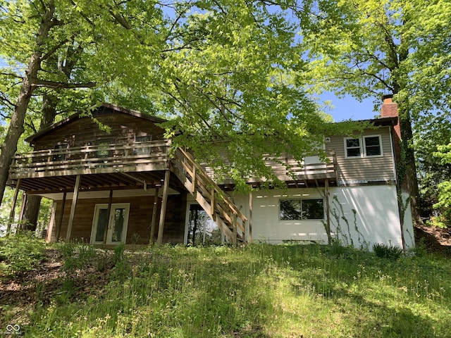 1925 Lee Kay Dr, Rockville, IN 47872 - rear view of house featuring a wooden deck, a chimney, and stairway