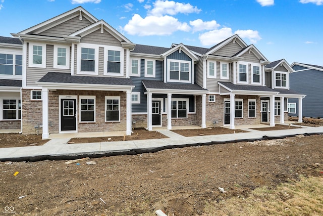 view of property featuring stone siding and board and batten siding