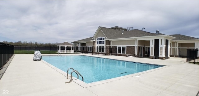 pool with a patio area, central AC, and fence