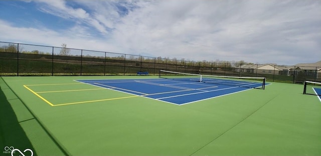 view of sport court with fence