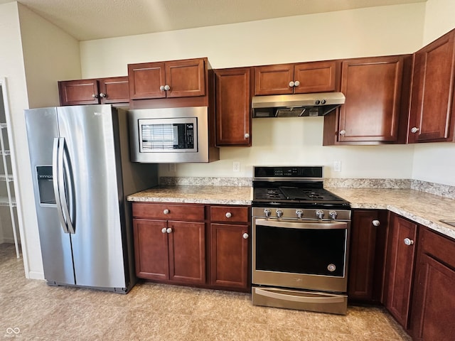 kitchen featuring under cabinet range hood, appliances with stainless steel finishes, and light countertops