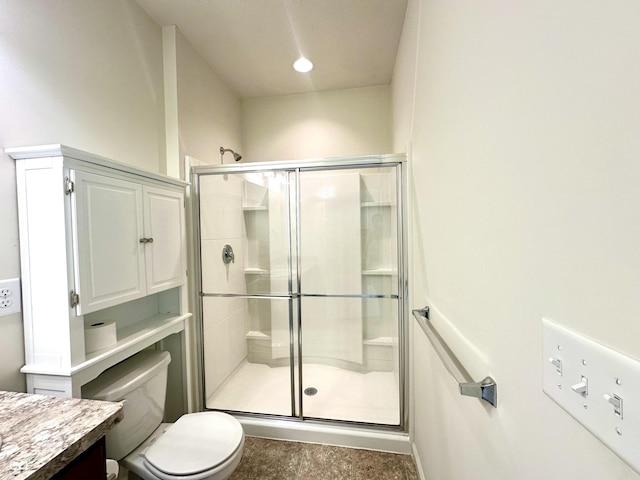 full bathroom with vanity, toilet, and a stall shower