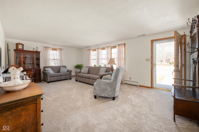 living area featuring a baseboard radiator and light carpet