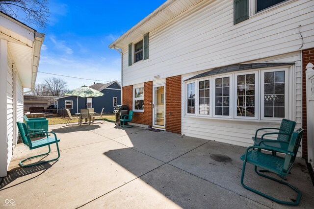 view of patio with outdoor dining space and area for grilling