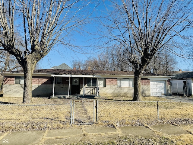 ranch-style home with a fenced front yard, brick siding, covered porch, and an attached garage