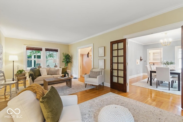 140 E 44th St, Indianapolis, IN 46205 - living area featuring crown molding, a notable chandelier, wood finished floors, and plenty of natural light